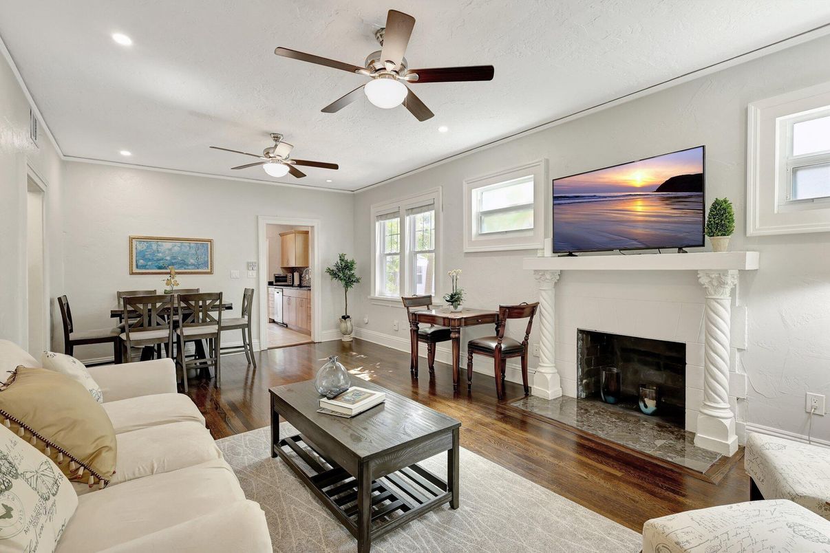 Dining room, Fireplace, Interior, Living room, Recessed Lighting, Wood Texture Flooring