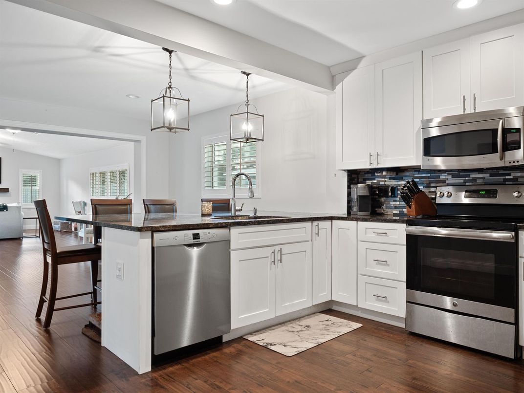 Dining room, Interior, Kitchen, Pendant Lights, Recessed Lighting, Stainless Steel Appliances, Wood Texture Flooring