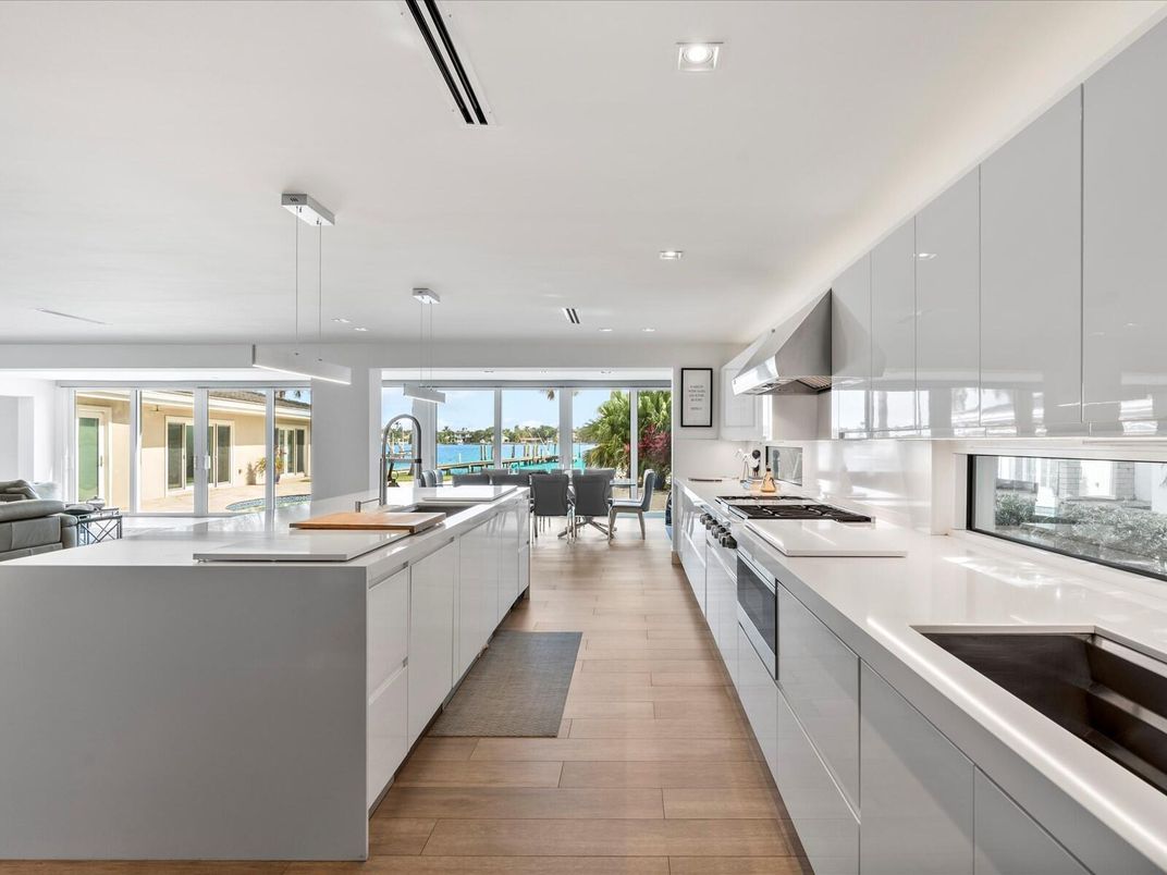Dining room, Interior, Kitchen, Pendant Lights, Recessed Lighting, Stainless Steel Appliances, Water, Wood Texture Flooring