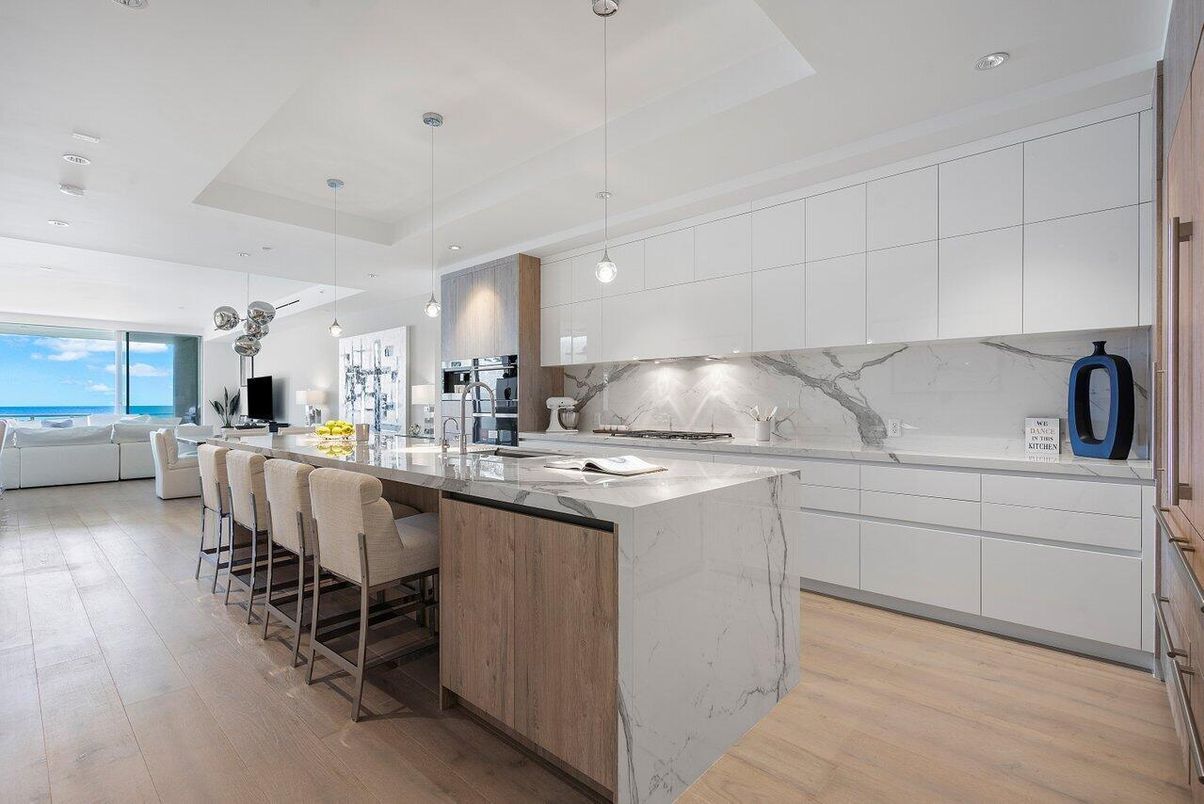 Interior, Kitchen, Marble Walls, Pendant Lights, Recessed Lighting, Stainless Steel Appliances, Water, Wood Texture Flooring