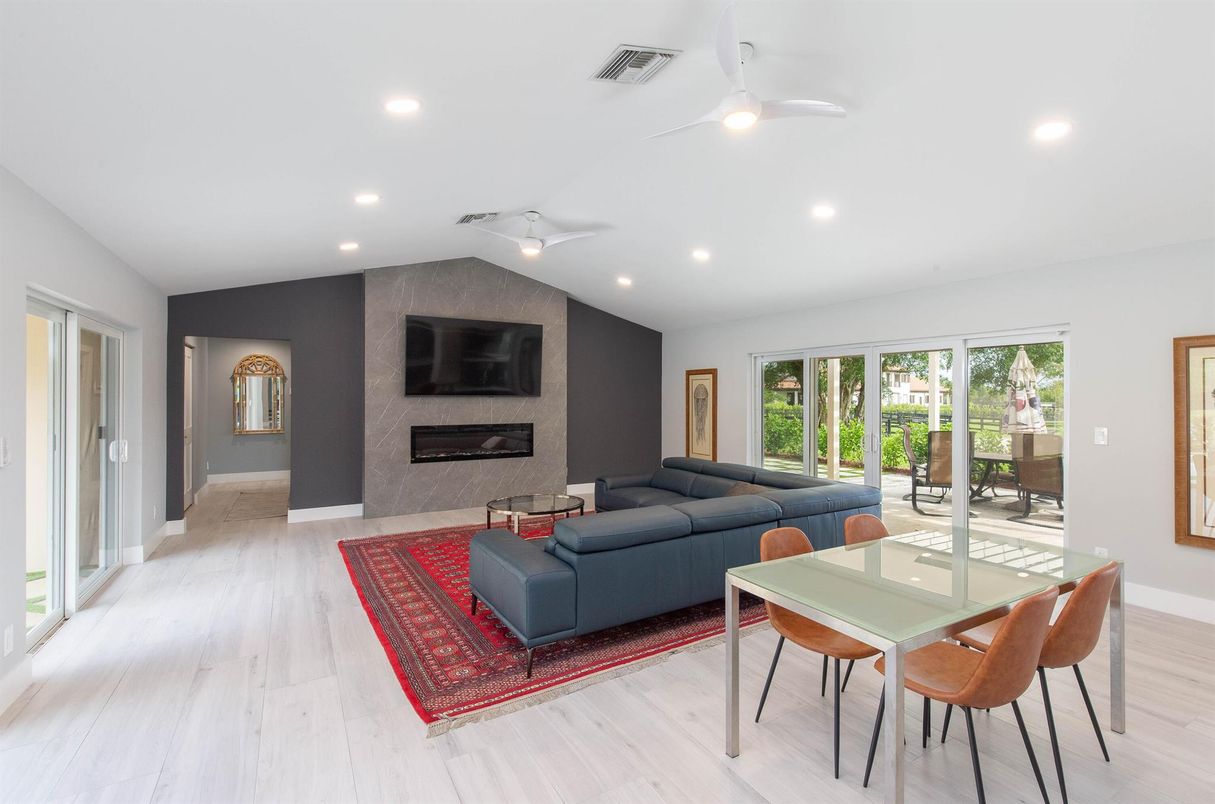 Dining room, Fireplace, Interior, Living room, Recessed Lighting, Wood Texture Flooring