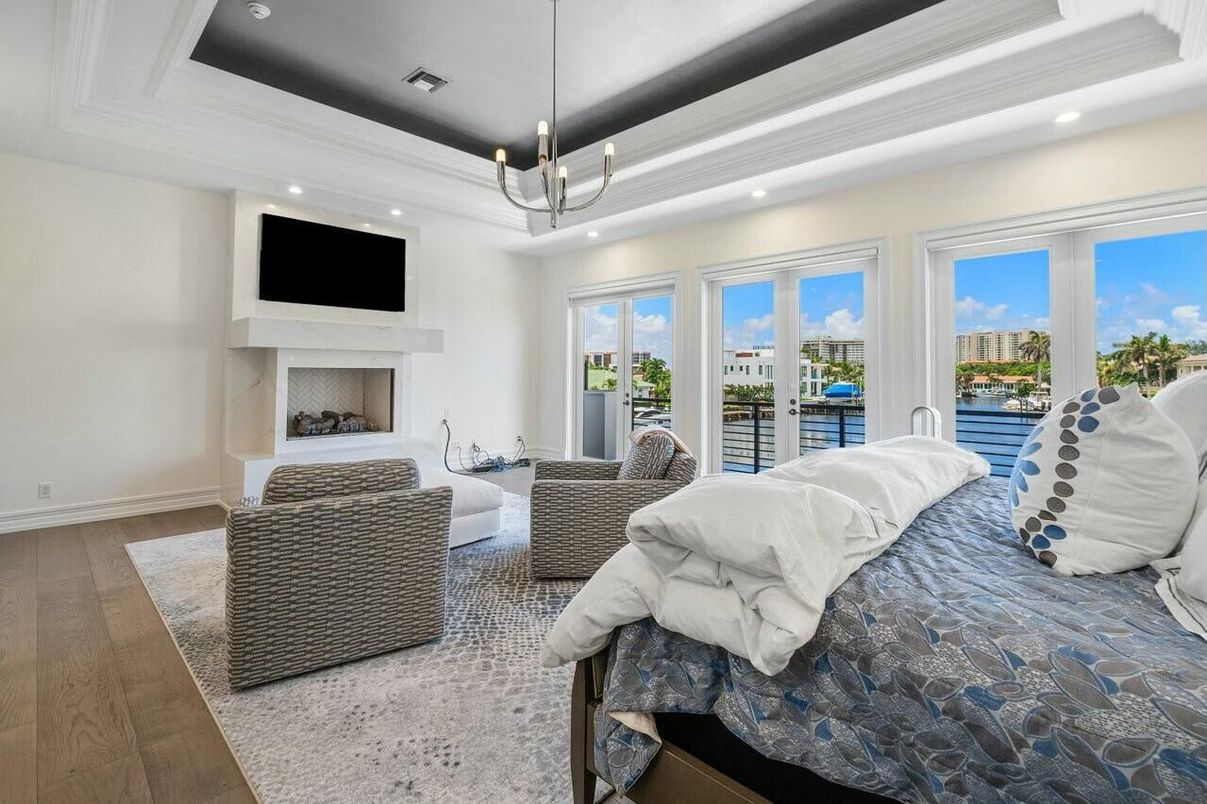 Bedroom, Fireplace, Interior, Pendant Lights, Recessed Lighting, Wood Texture Flooring