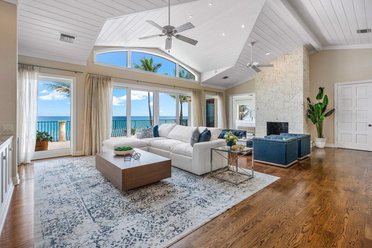 Fireplace, Interior, Living room, Recessed Lighting, Stone Walls, Water, Wood Texture Flooring