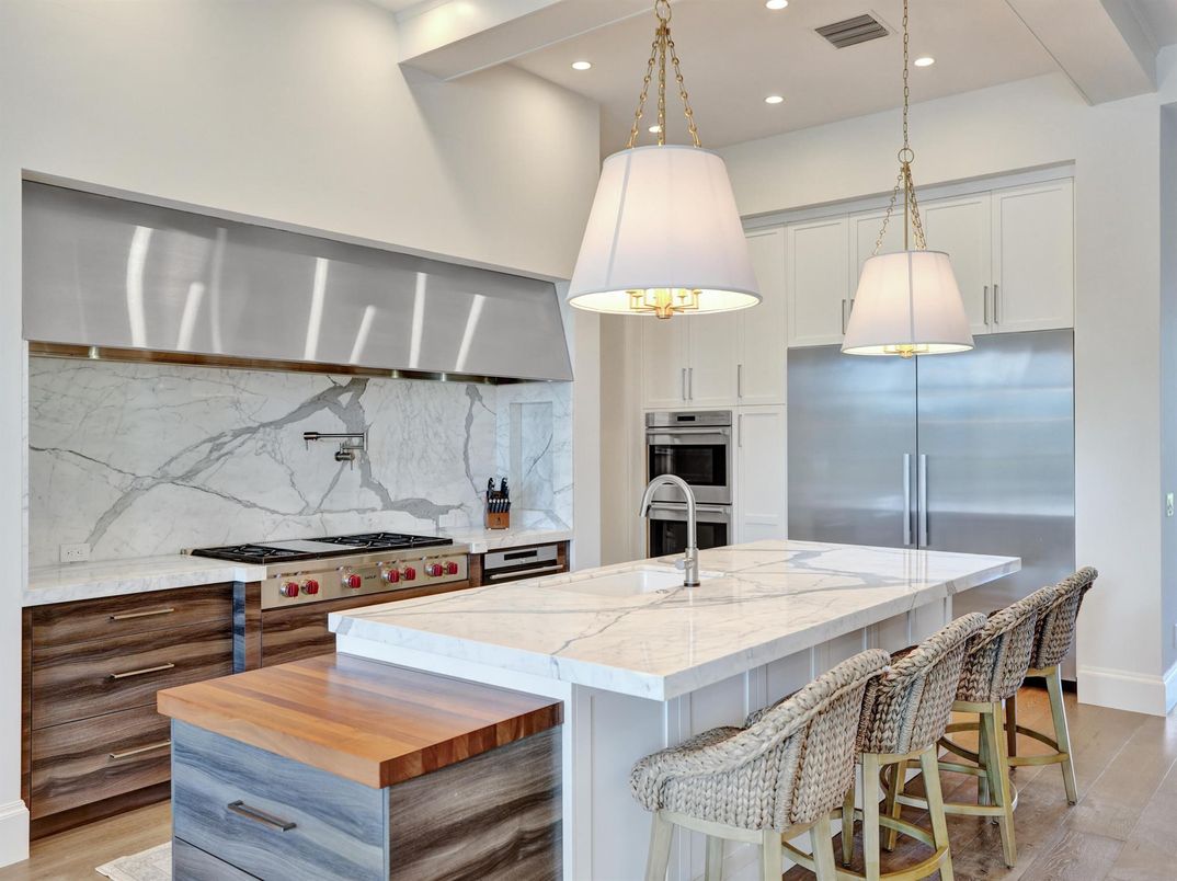 Interior, Kitchen, Marble Walls, Pendant Lights, Recessed Lighting, Stainless Steel Appliances