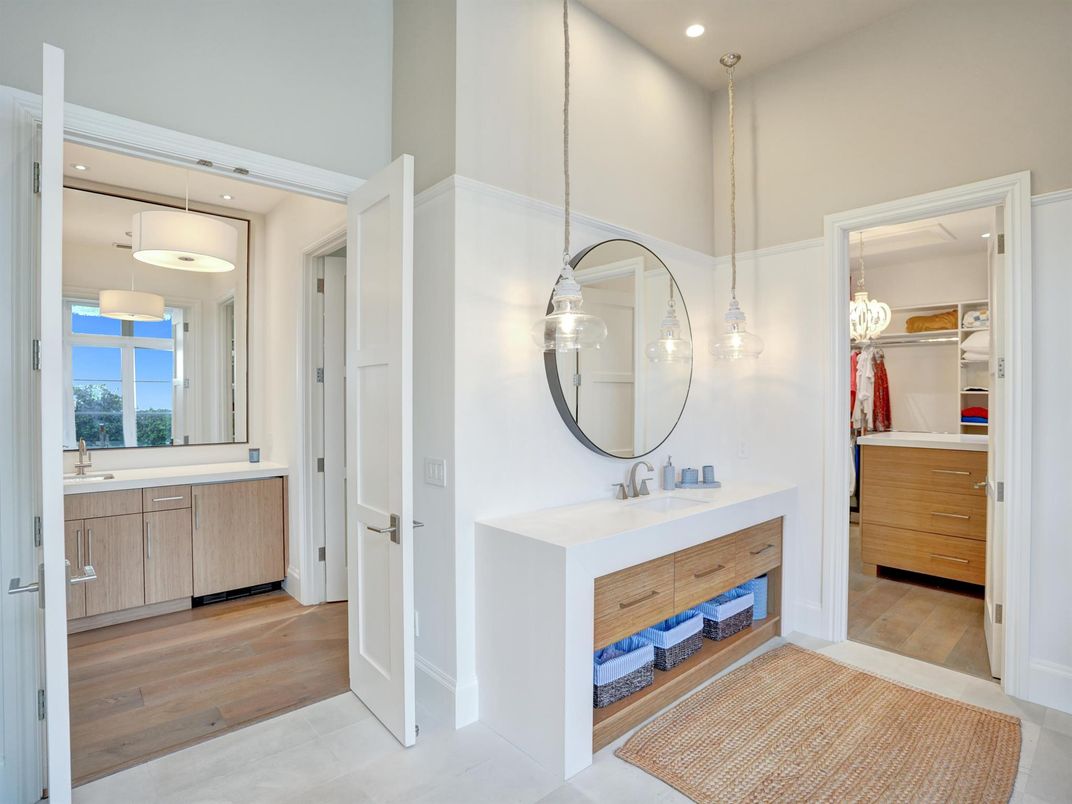 Bathroom, Dual Sink Vanities, Interior, Pendant Lights, Recessed Lighting, Wood Texture Flooring