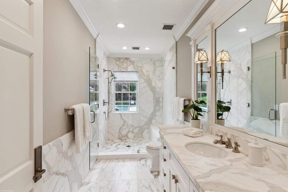 Bathroom, Dual Sink Vanities, Glass Shower, Interior, Marble, Marble Walls, Recessed Lighting