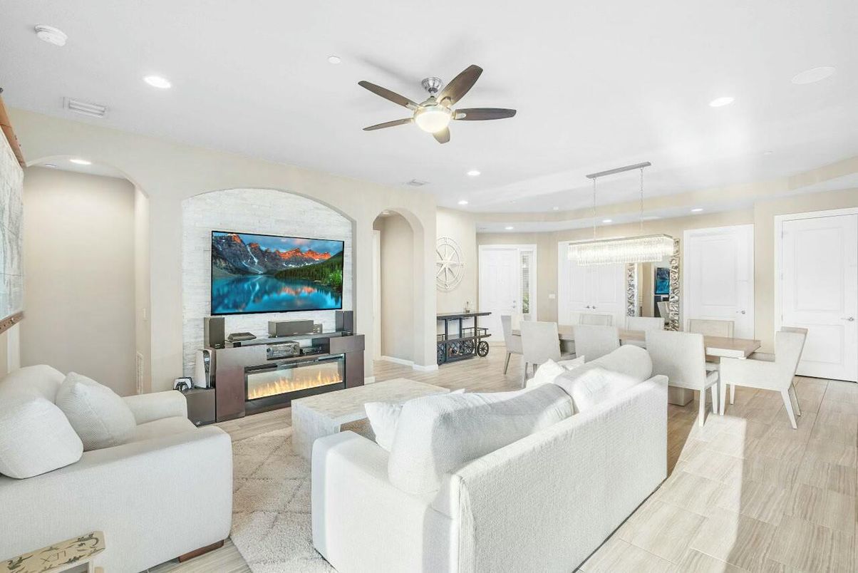 Chandelier, Dining room, Fireplace, Interior, Living room, Pendant Lights, Recessed Lighting, Wood Texture Flooring