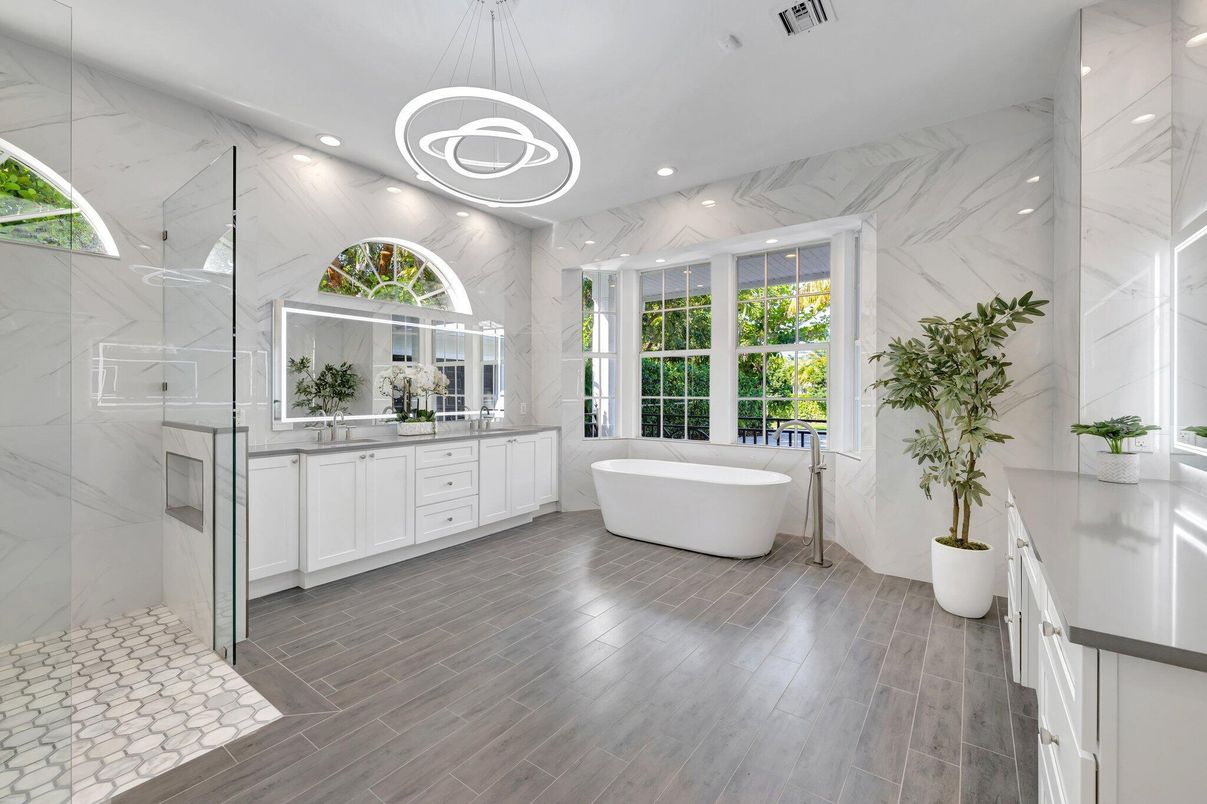 Bathroom, Dual Sink Vanities, Free Standing Baths, Interior, Marble Walls, Pendant Lights, Recessed Lighting, Wood Texture Flooring