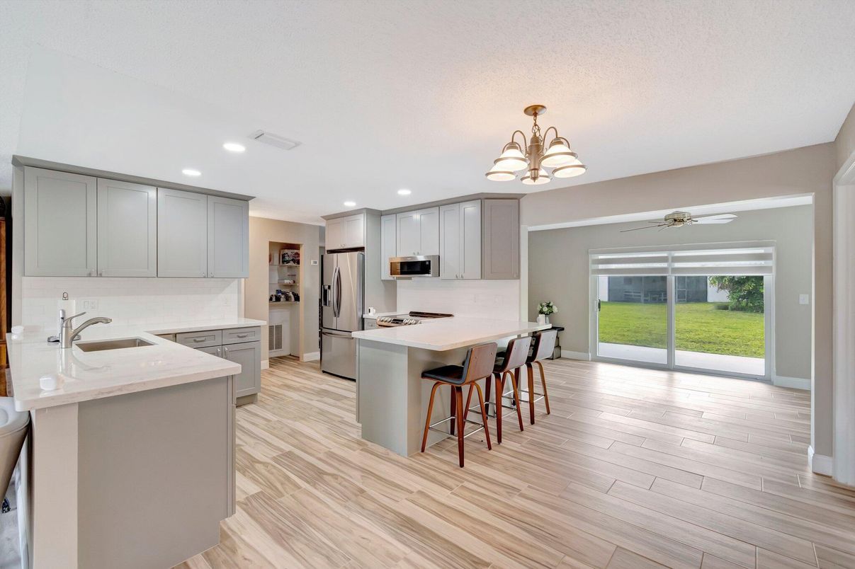 Chandelier, Interior, Kitchen, Recessed Lighting, Stainless Steel Appliances, Wood Texture Flooring