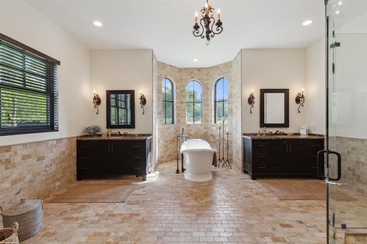 Bathroom, Chandelier, Dual Sink Vanities, Free Standing Baths, Glass Shower, Interior, Recessed Lighting, Stone Walls