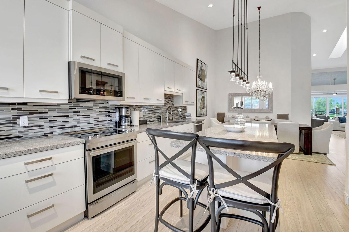 Chandelier, Dining room, Interior, Kitchen, Pendant Lights, Recessed Lighting, Stainless Steel Appliances, Wood Texture Flooring