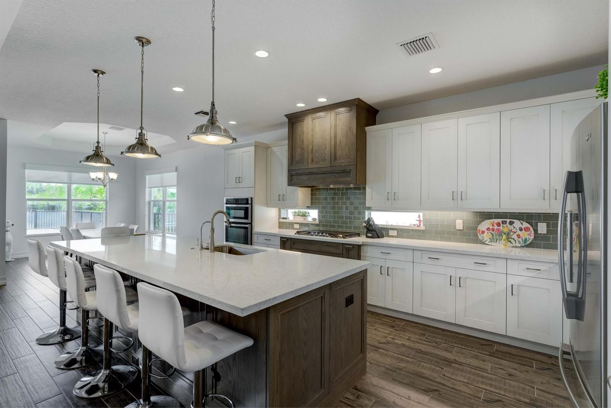 Dining room, Interior, Kitchen, Pendant Lights, Recessed Lighting, Stainless Steel Appliances, Wood Texture Flooring