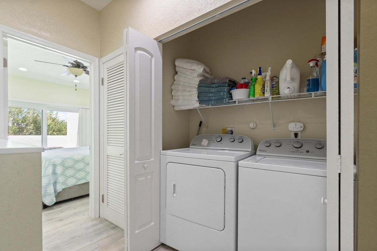 Bedroom, Interior, Recessed Lighting, Utility Closets, Washer, Wood Texture Flooring