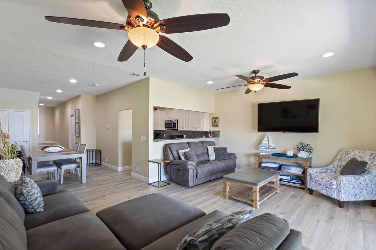 Dining room, Interior, Kitchen, Living room, Recessed Lighting, Stainless Steel Appliances, Wood Texture Flooring