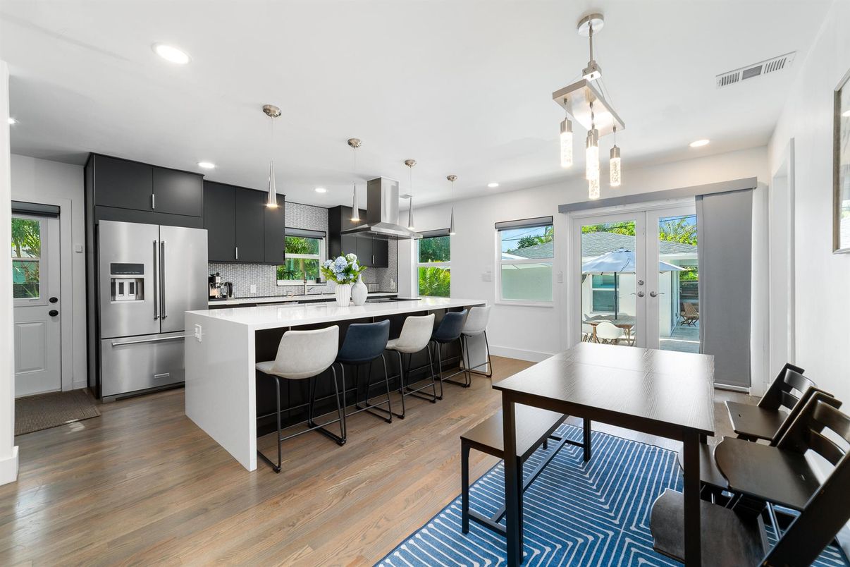 Dining room, Interior, Kitchen, Pendant Lights, Recessed Lighting, Stainless Steel Appliances, Wood Texture Flooring