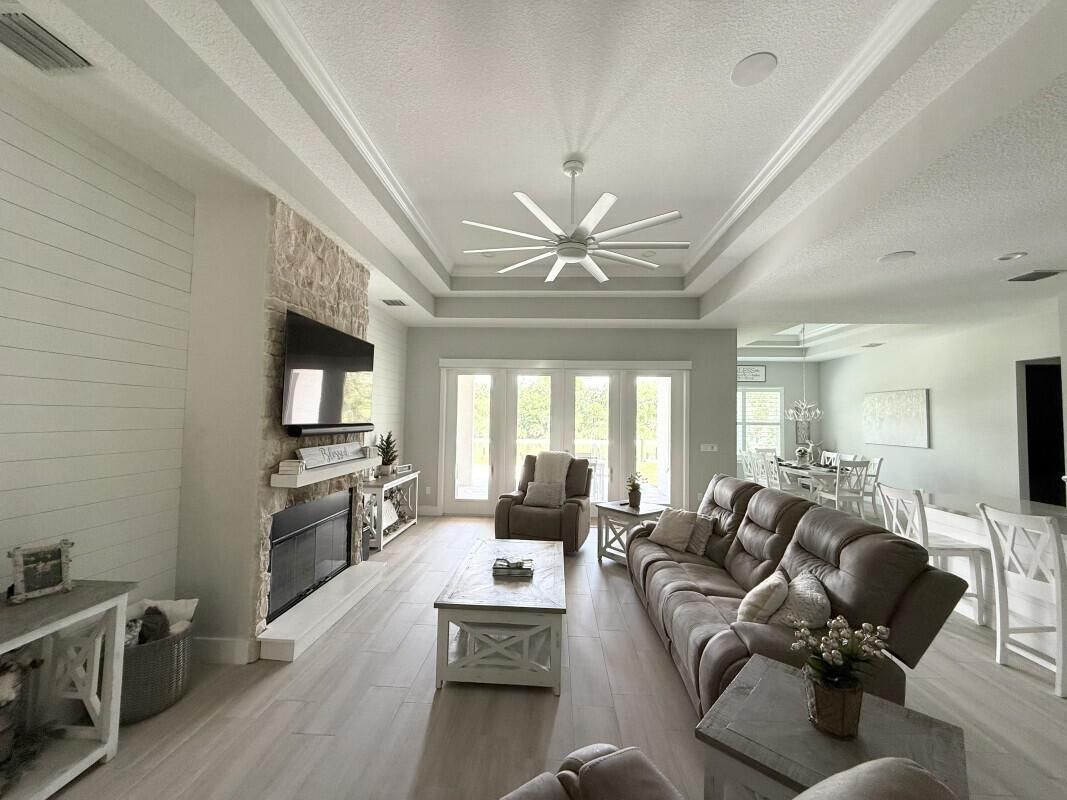 Dining room, Fireplace, Interior, Living room, Recessed Lighting, Wood Texture Flooring