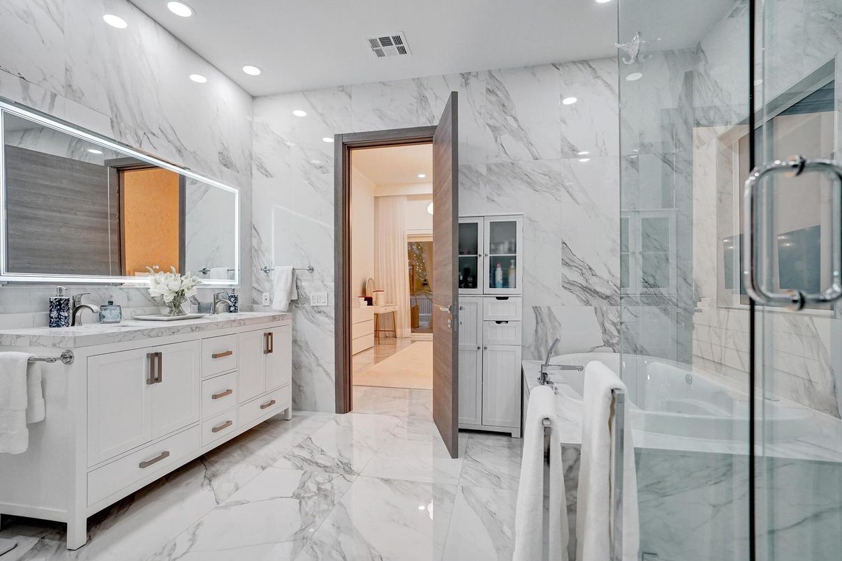 Bathroom, Dual Sink Vanities, Glass Shower, Interior, Marble, Marble Walls, Recessed Lighting
