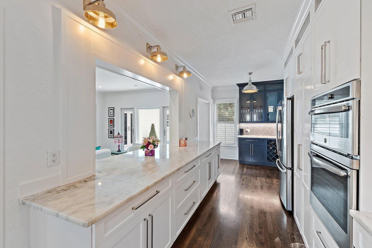 Interior, Kitchen, Pendant Lights, Stainless Steel Appliances, Tile Countertops, Wood Texture Flooring