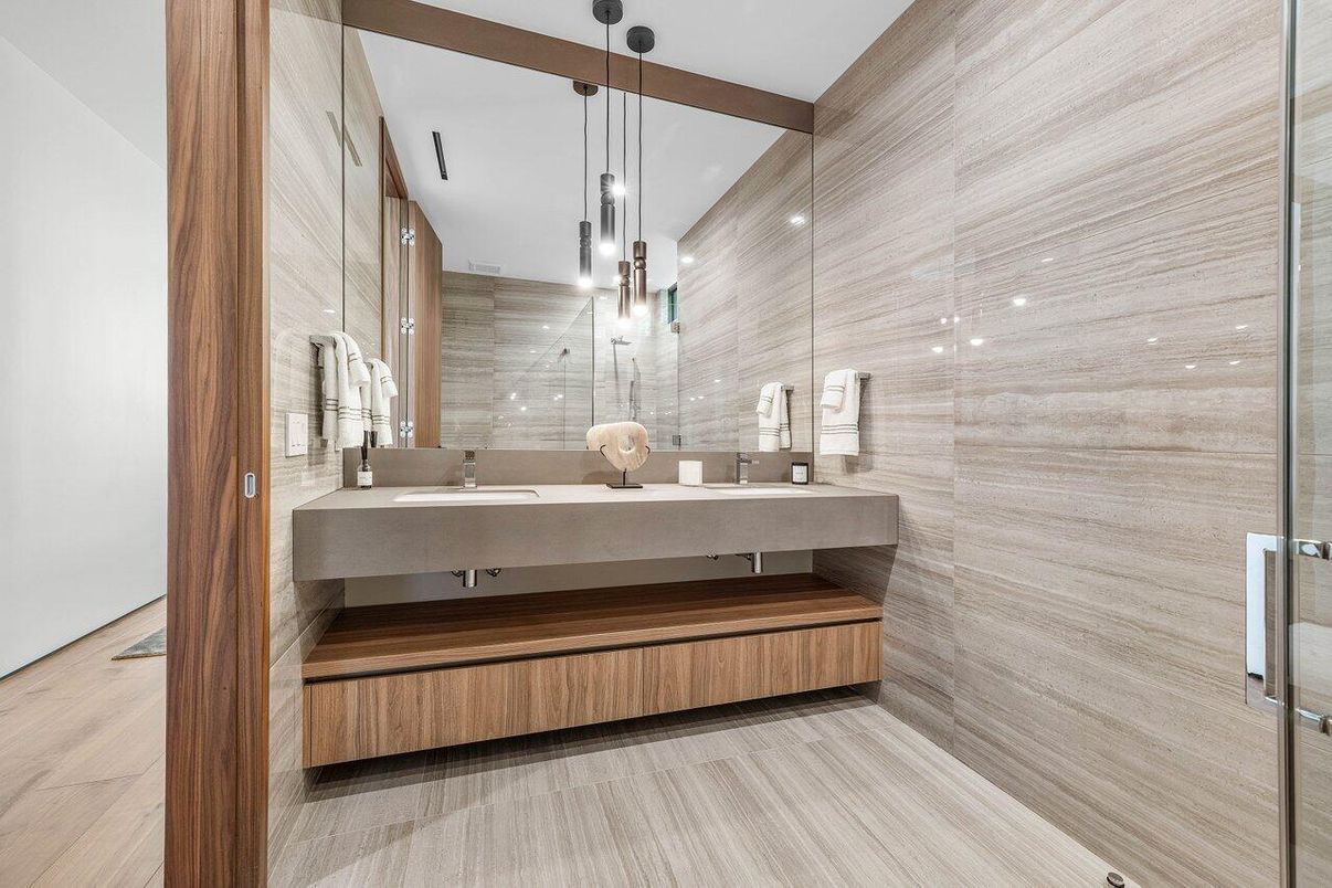 Bathroom, Dual Sink Vanities, Glass Shower, Interior, Pendant Lights, Recessed Lighting, Wood Texture Flooring