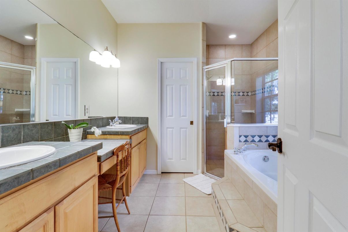 Bathroom, Dual Sink Vanities, Glass Shower, Interior, Recessed Lighting, Tile Countertops