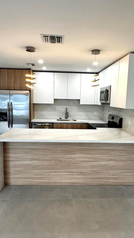Interior, Kitchen, Marble Walls, Pendant Lights, Stainless Steel Appliances