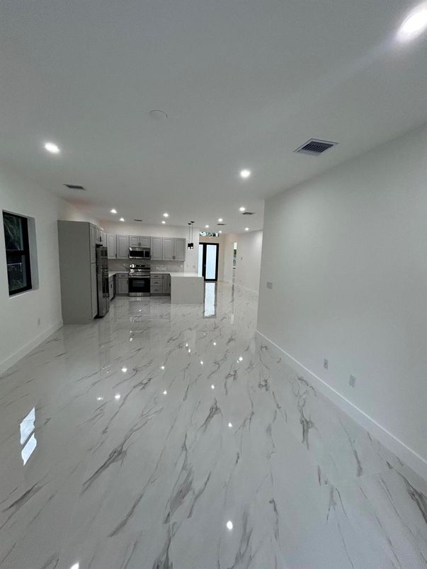 Empty room, Interior, Kitchen, Marble, Pendant Lights, Recessed Lighting, Stainless Steel Appliances
