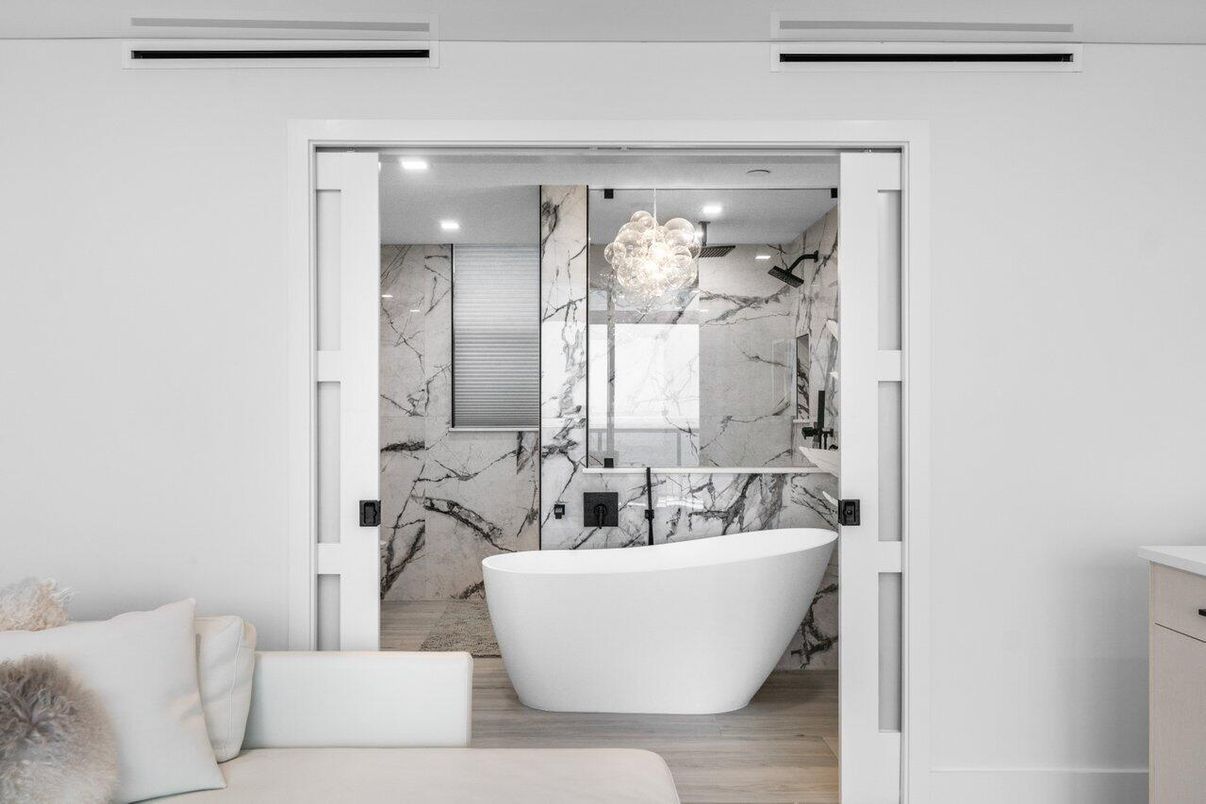 Bathroom, Free Standing Baths, Interior, Marble Walls, Recessed Lighting, Wood Texture Flooring