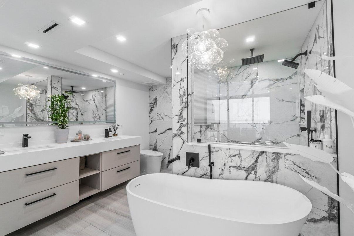 Bathroom, Dual Sink Vanities, Free Standing Baths, Glass Shower, Interior, Marble Walls, Pendant Lights, Recessed Lighting, Wood Texture Flooring