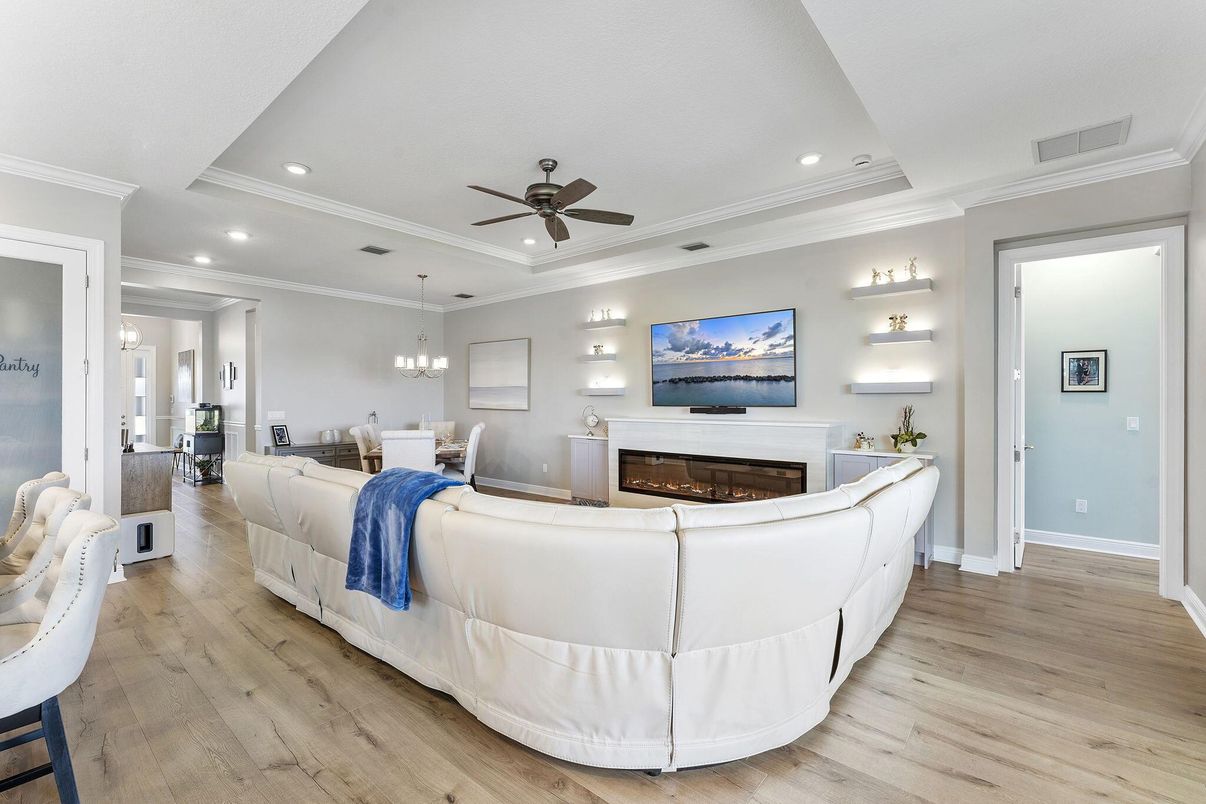 Chandelier, Dining room, Fireplace, Interior, Living room, Pendant Lights, Recessed Lighting, Wood Texture Flooring