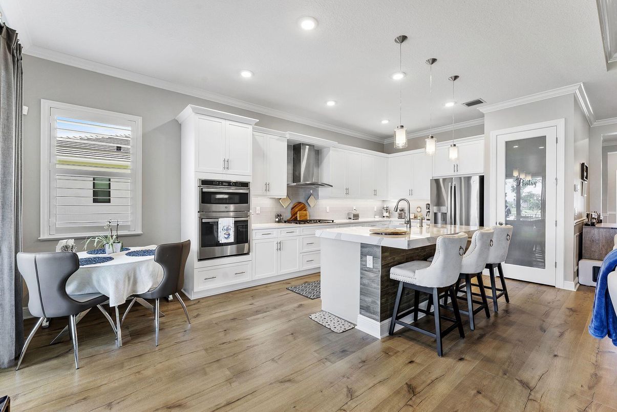 Dining room, Interior, Kitchen, Pendant Lights, Recessed Lighting, Stainless Steel Appliances, Wood Texture Flooring