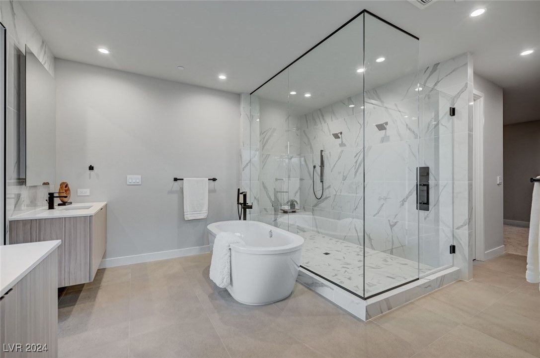 Bathroom, Free Standing Baths, Glass Shower, Interior, Marble Walls, Recessed Lighting