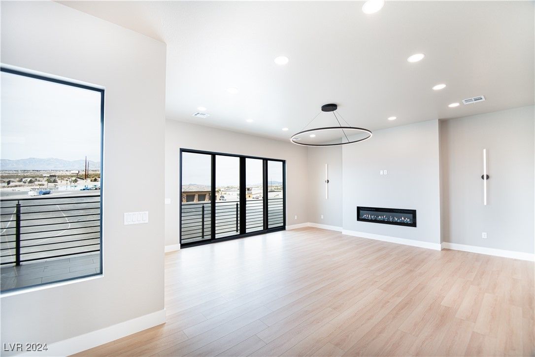 Empty room, Fireplace, Interior, Pendant Lights, Recessed Lighting, Wood Texture Flooring