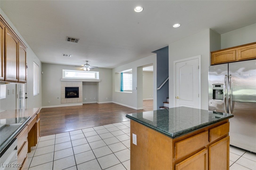 Fireplace, Interior, Kitchen, Recessed Lighting, Stainless Steel Appliances, Wood Texture Flooring
