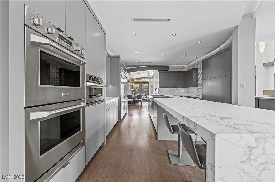 Dining room, Interior, Kitchen, Recessed Lighting, Stainless Steel Appliances, Wood Texture Flooring