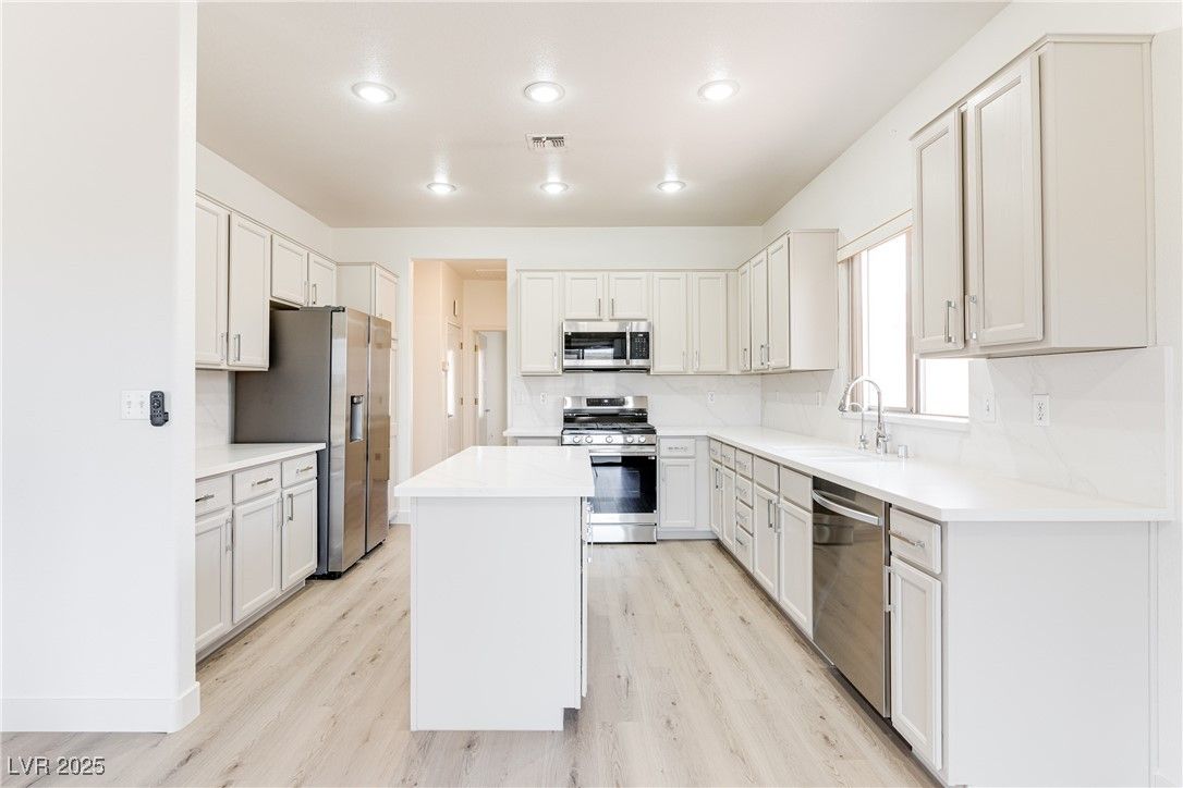 Interior, Kitchen, Recessed Lighting, Stainless Steel Appliances, Wood Texture Flooring