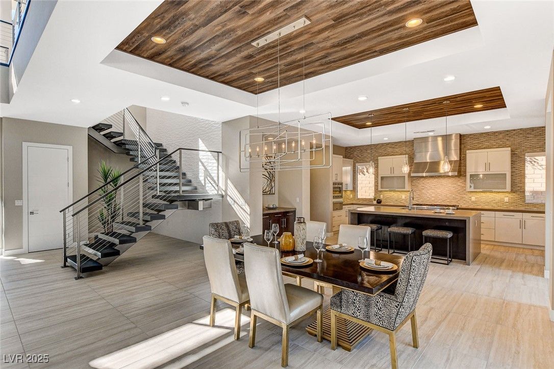Chandelier, Dining room, Interior, Kitchen, Pendant Lights, Recessed Lighting, Stainless Steel Appliances, Wooden Ceilings, Wood Texture Flooring