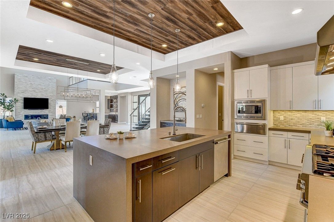 Dining room, Fireplace, Interior, Kitchen, Living room, Pendant Lights, Recessed Lighting, Stainless Steel Appliances, Wooden Ceilings