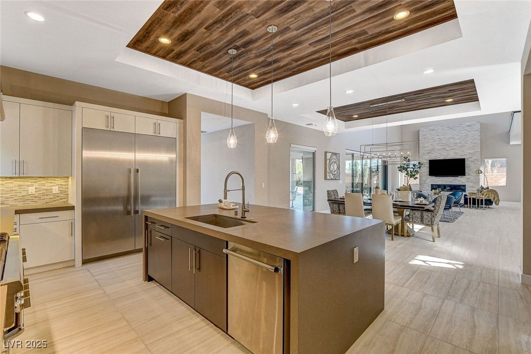 Dining room, Interior, Kitchen, Living room, Pendant Lights, Recessed Lighting, Stainless Steel Appliances, Stone Walls, Wooden Ceilings