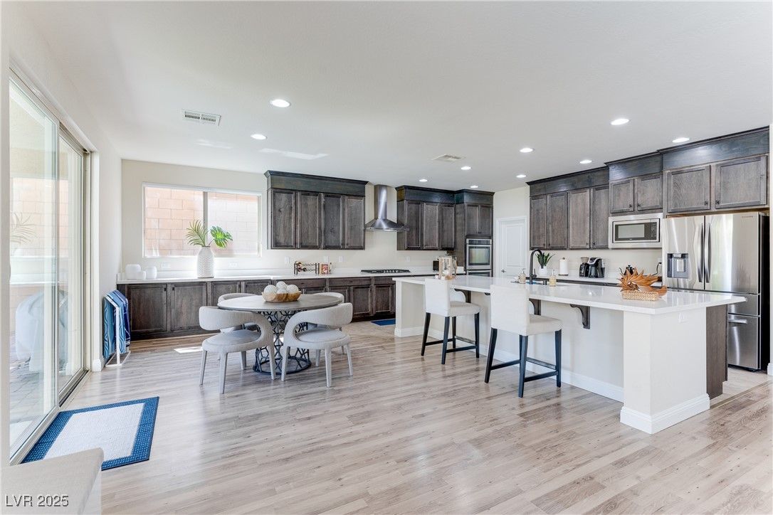 Dining room, Interior, Kitchen, Recessed Lighting, Stainless Steel Appliances, Wood Texture Flooring