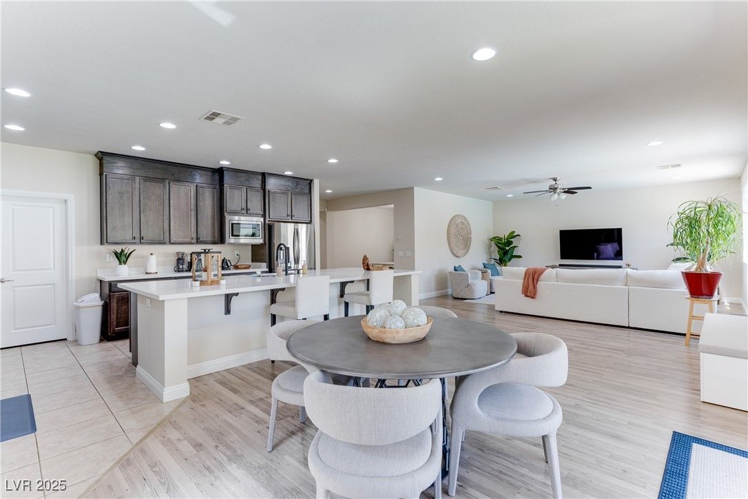 Dining room, Interior, Kitchen, Living room, Recessed Lighting, Stainless Steel Appliances, Wood Texture Flooring