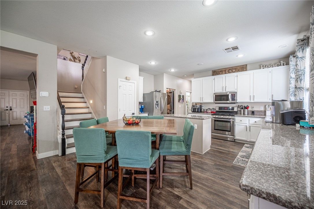 Dining room, Interior, Kitchen, Recessed Lighting, Stainless Steel Appliances, Wood Texture Flooring