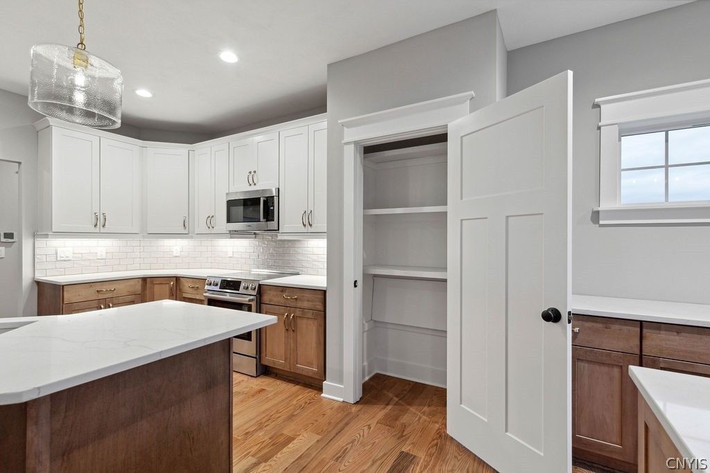 Interior, Kitchen, Pendant Lights, Recessed Lighting, Stainless Steel Appliances, Wood Texture Flooring