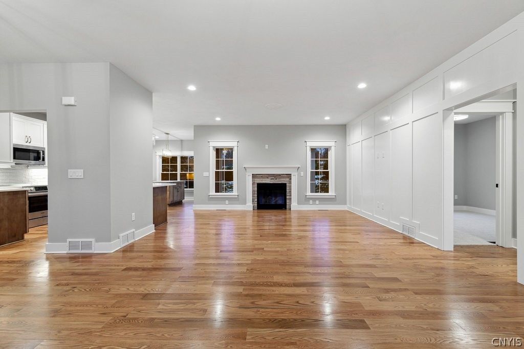 Empty room, Fireplace, Interior, Kitchen, Pendant Lights, Recessed Lighting, Wood Texture Flooring