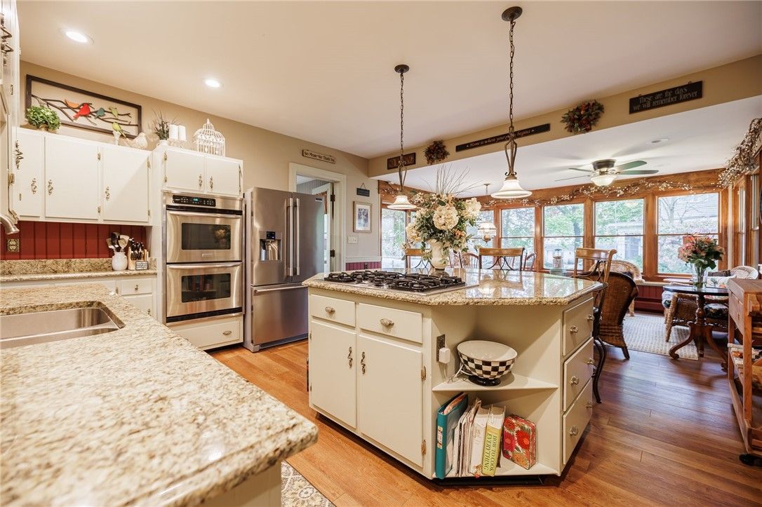 Dining room, Interior, Kitchen, Pendant Lights, Recessed Lighting, Stainless Steel Appliances, Wood Texture Flooring