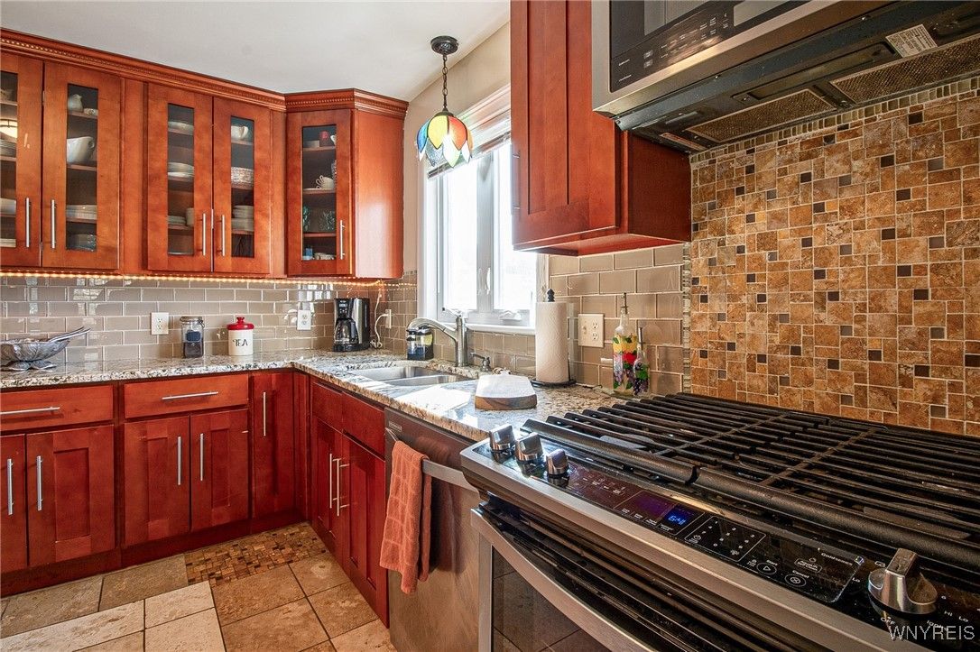 Interior, Kitchen, Pendant Lights, Stainless Steel Appliances, Stone Walls