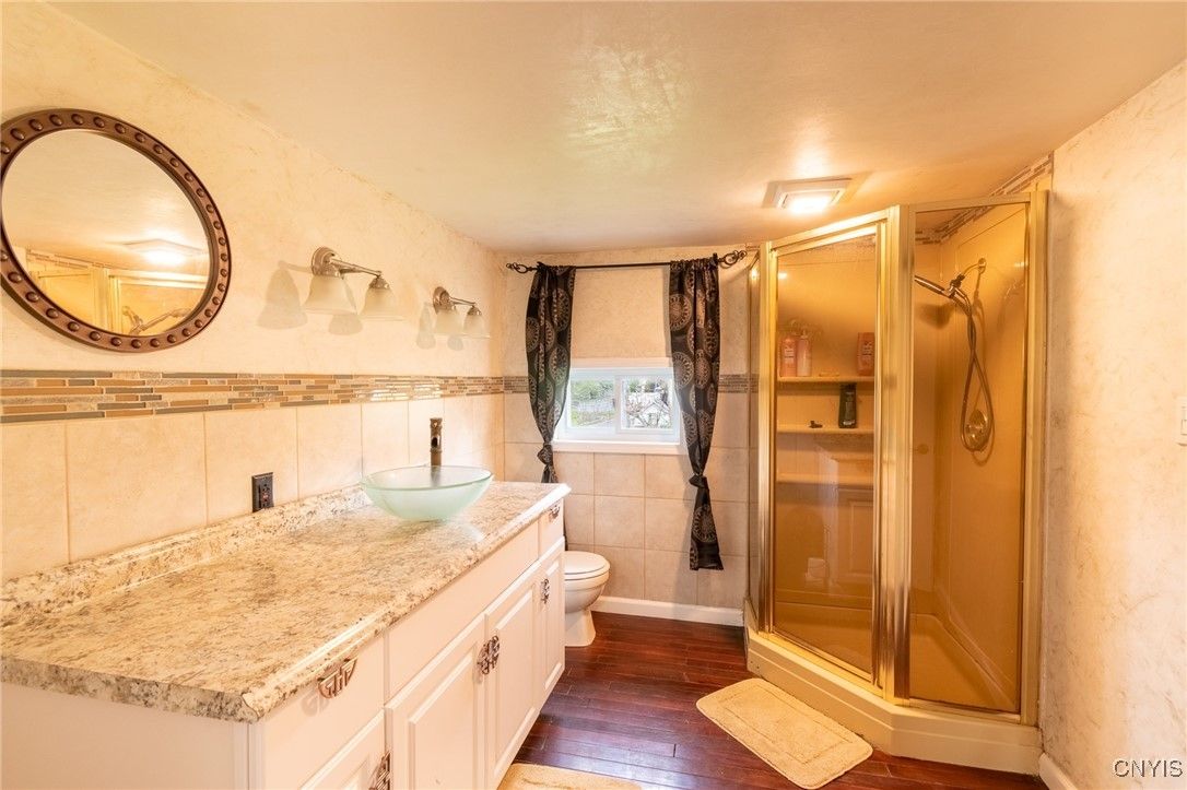 Bathroom, Dual Sink Vanities, Glass Shower, Interior, Wood Texture Flooring