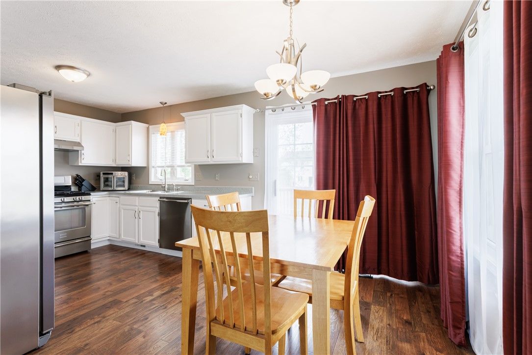 Chandelier, Dining room, Interior, Kitchen, Pendant Lights, Stainless Steel Appliances, Wood Texture Flooring