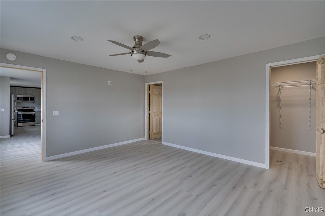 Empty room, Interior, Kitchen, Stainless Steel Appliances, Wood Texture Flooring