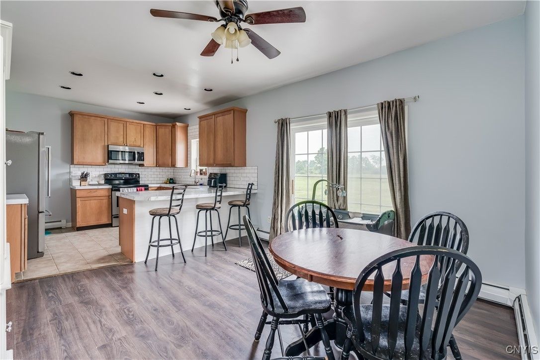 Dining room, Interior, Kitchen, Recessed Lighting, Stainless Steel Appliances, Wood Texture Flooring