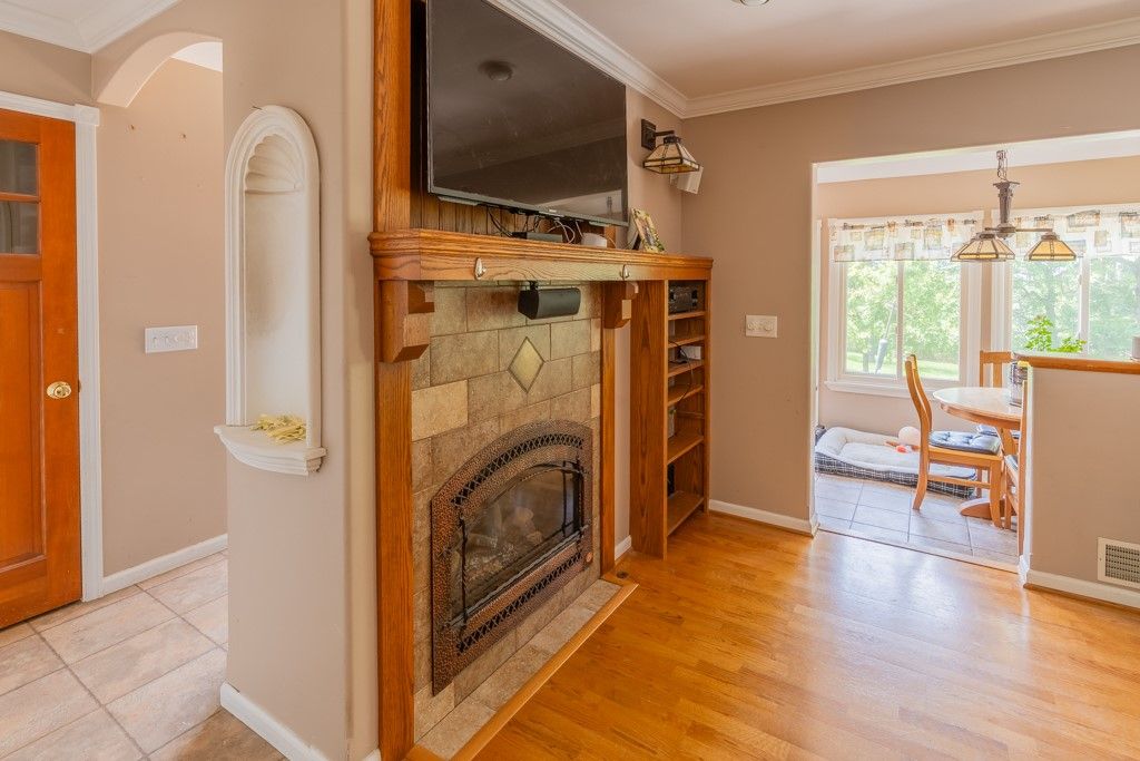 Dining room, Fireplace, Interior, Pendant Lights, Wood Texture Flooring